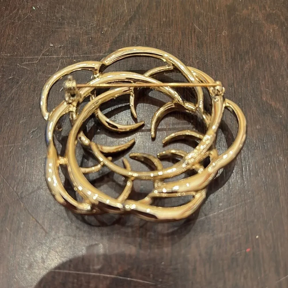 Elegant Gold Circular Brooch